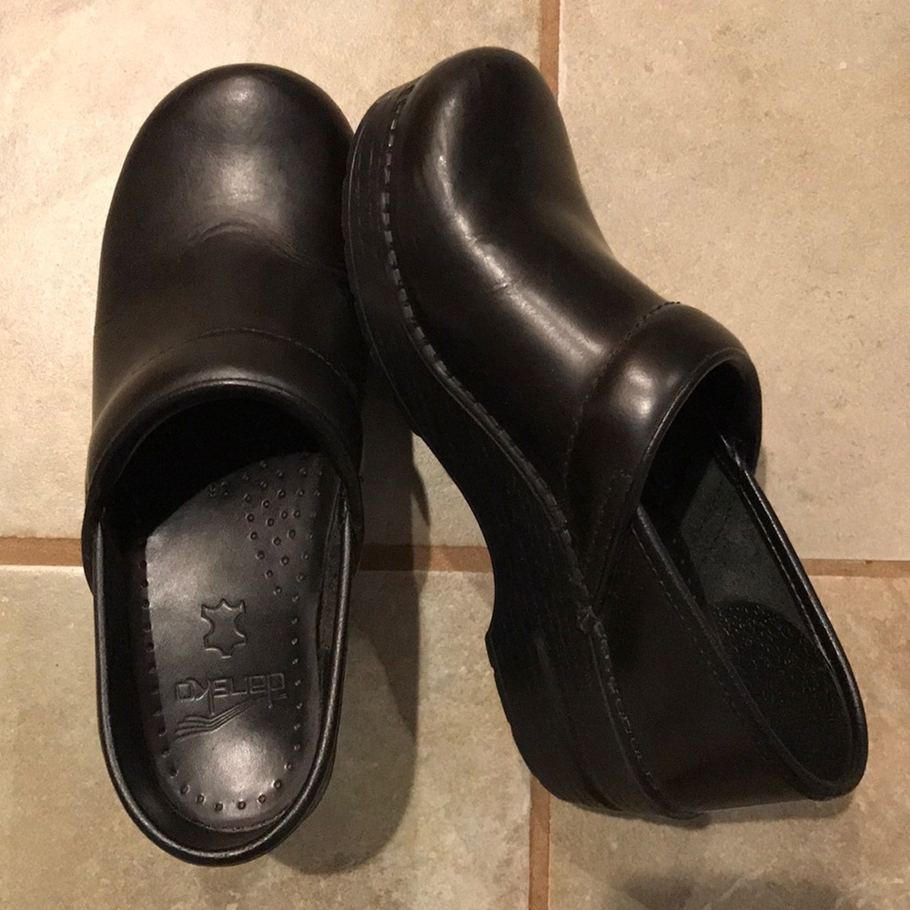 Women’s Dansko black leather clogs